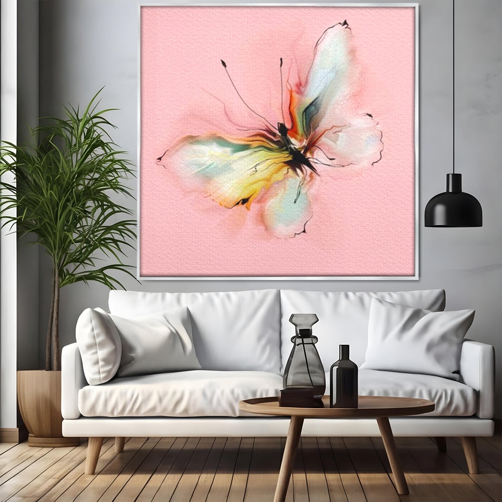 Tablou canvas cu tablou canvas cu fluture in pastel, in rama de aluminiu argintiu, pe perete intr-un living